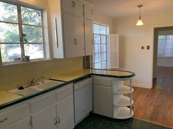 a bathroom with a sink and a window