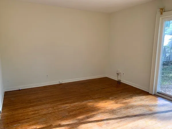 a view of an empty room and window