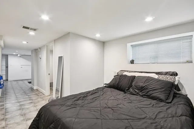 a bedroom with a bed and a walk in closet