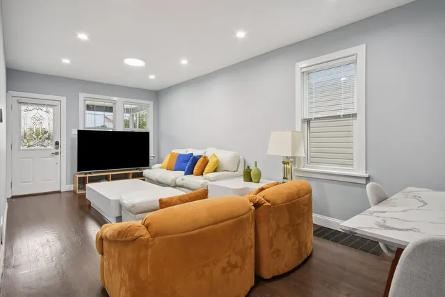 a bedroom with a bed and a television