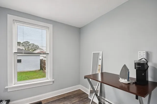 a workspace with furniture and window