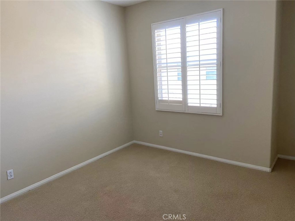 187 Wild Lilac Irvine, CA 92620 - Photo 11 of 16 an empty room with a window
