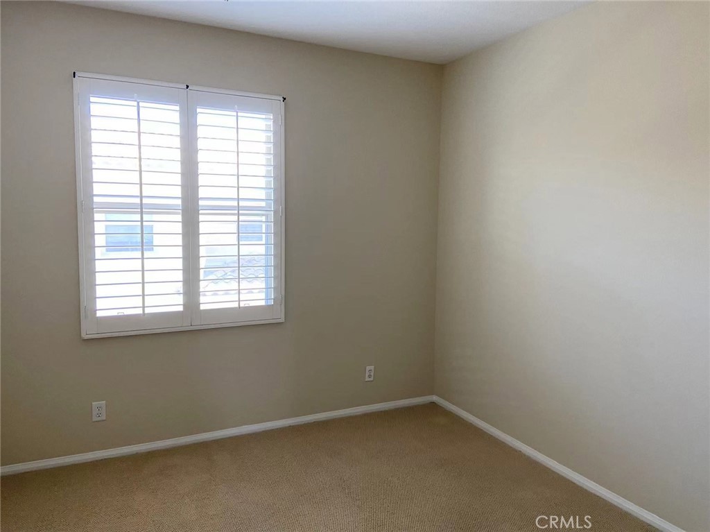 187 Wild Lilac Irvine, CA 92620 - Photo 12 of 16 an empty room with a window