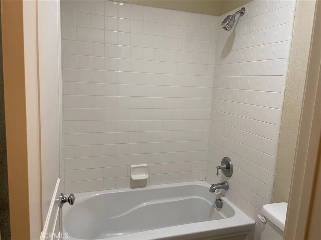 187 Wild Lilac Irvine, CA 92620 - Photo 14 of 16 a bath tub sitting next to a white sink