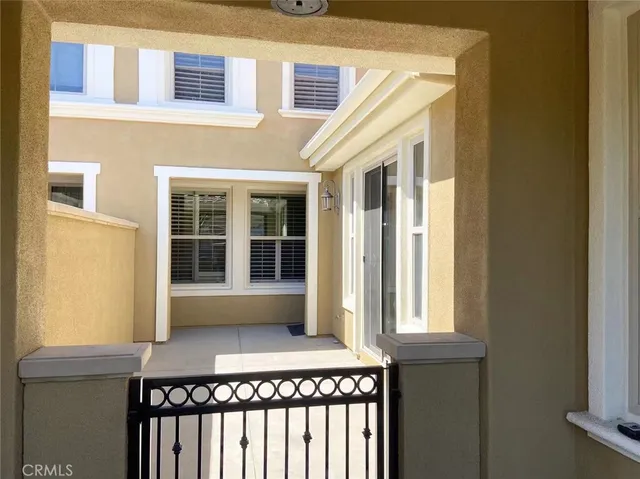 a front view of a house with a large window