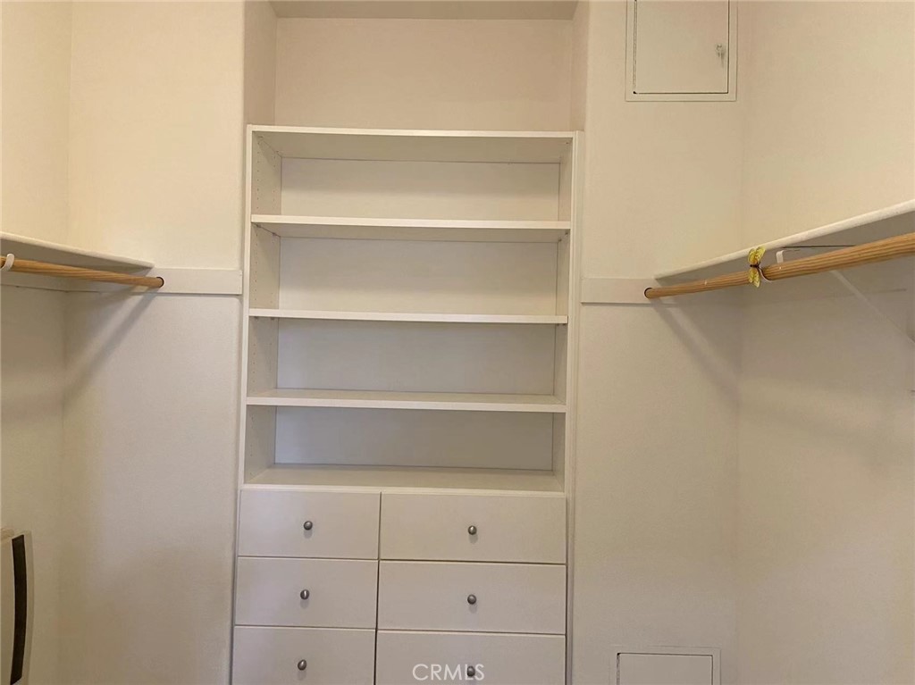 187 Wild Lilac Irvine, CA 92620 - Photo 10 of 16 a view of walk in closet with empty racks