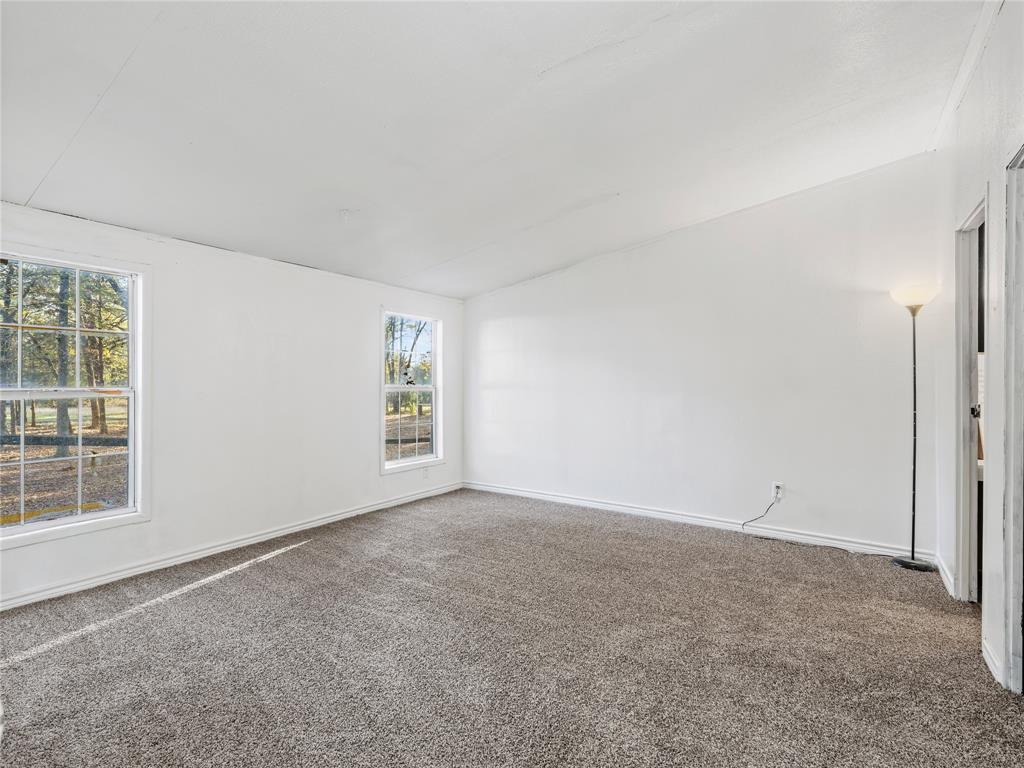 202 Forgotten Lane Mabank, TX 75156 - Photo 12 of 36 an empty room with windows