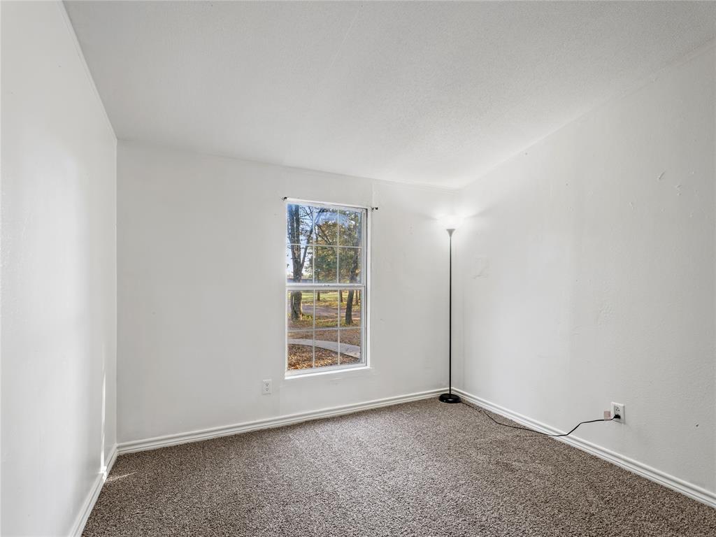 202 Forgotten Lane Mabank, TX 75156 - Photo 14 of 36 an empty room with windows