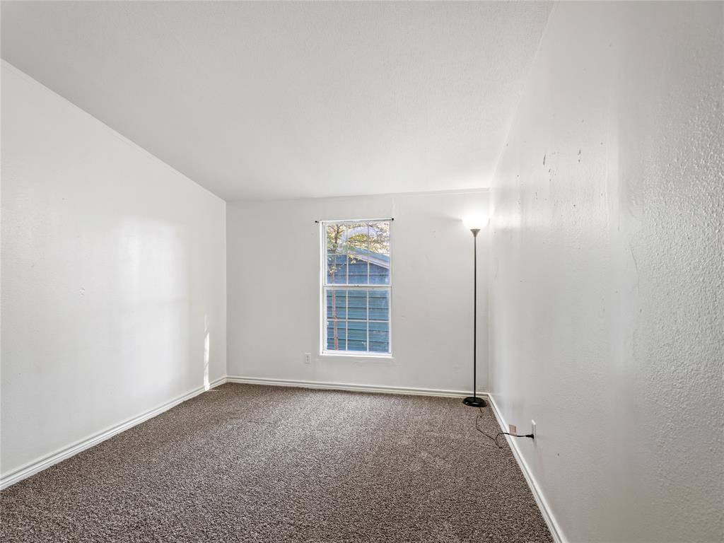 202 Forgotten Lane Mabank, TX 75156 - Photo 15 of 36 an empty room with windows