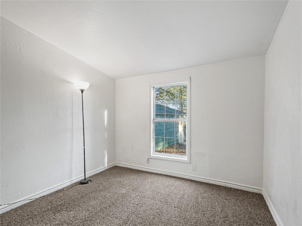 202 Forgotten Lane Mabank, TX 75156 - Photo 16 of 36 an empty room with windows