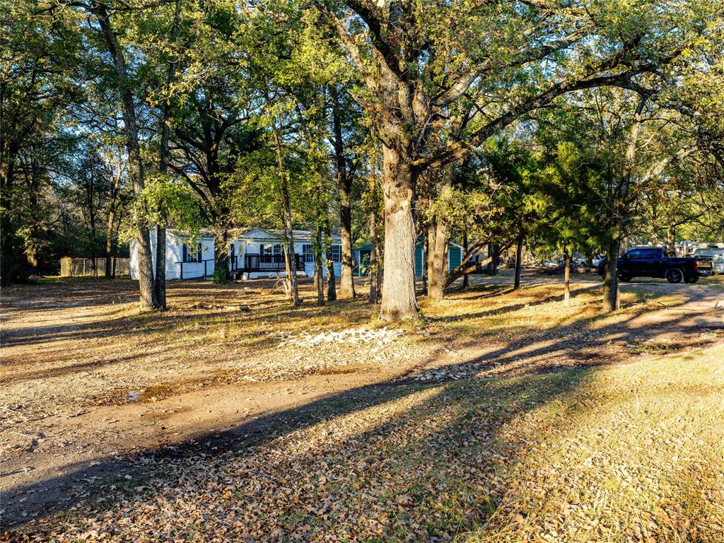 202 Forgotten Lane Mabank, TX 75156 - Photo 2 of 36 a view of a swimming pool with an outdoor space