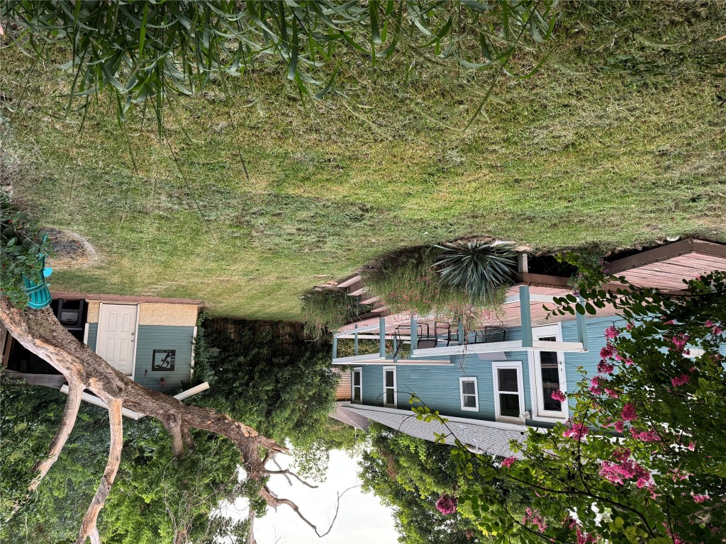 505 East 4th Street Georgetown, TX 78626 - Photo 14 of 18 a view of a house with yard and a garden