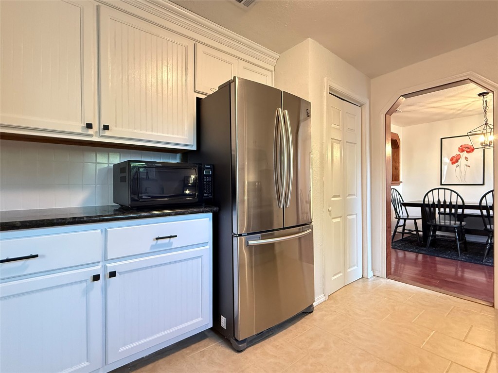 505 East 4th Street Georgetown, TX 78626 - Photo 7 of 18 a kitchen with stainless steel appliances granite countertop a refrigerator and a stove top oven