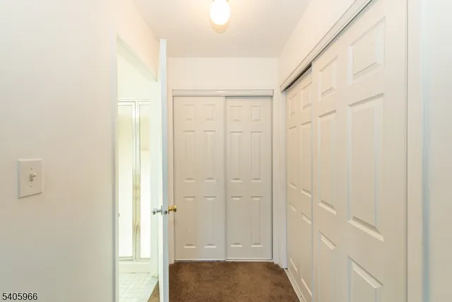 a spacious bathroom with a double vanity sink a mirror and a bathtub
