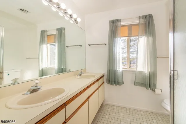 a bathroom with a shower and a toilet