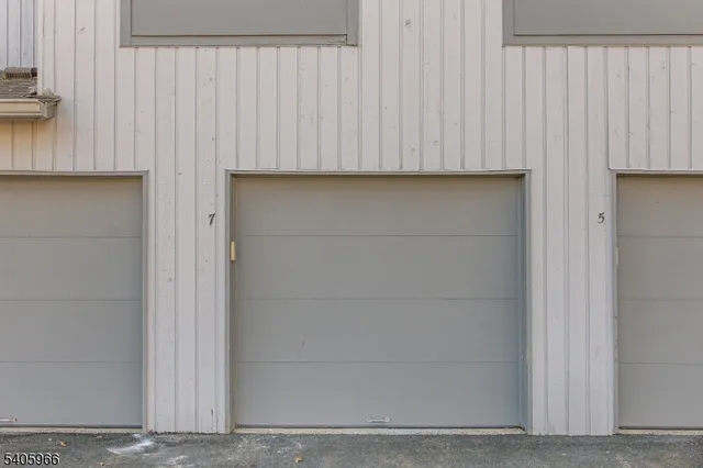 an aerial view of residential house with green space