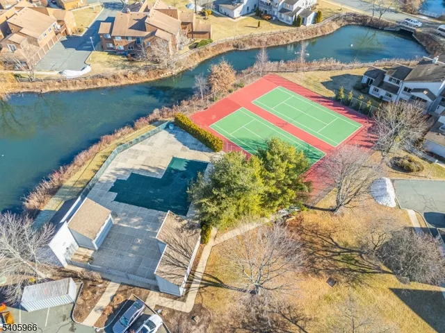 an aerial view of a house with a lake view