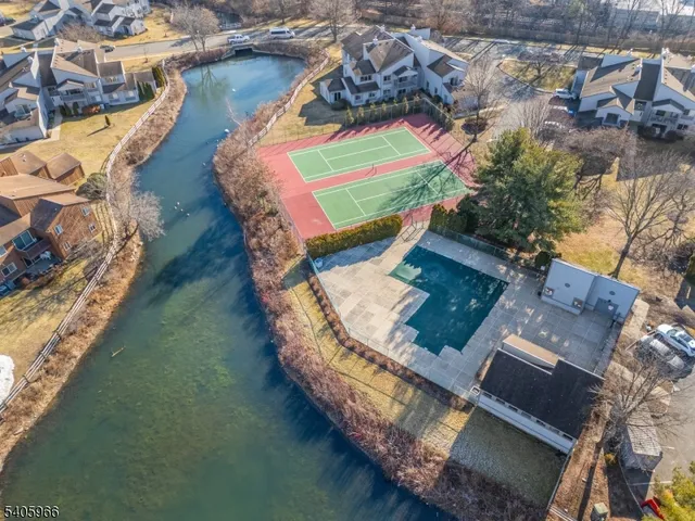 a aerial view of a house with a lake view