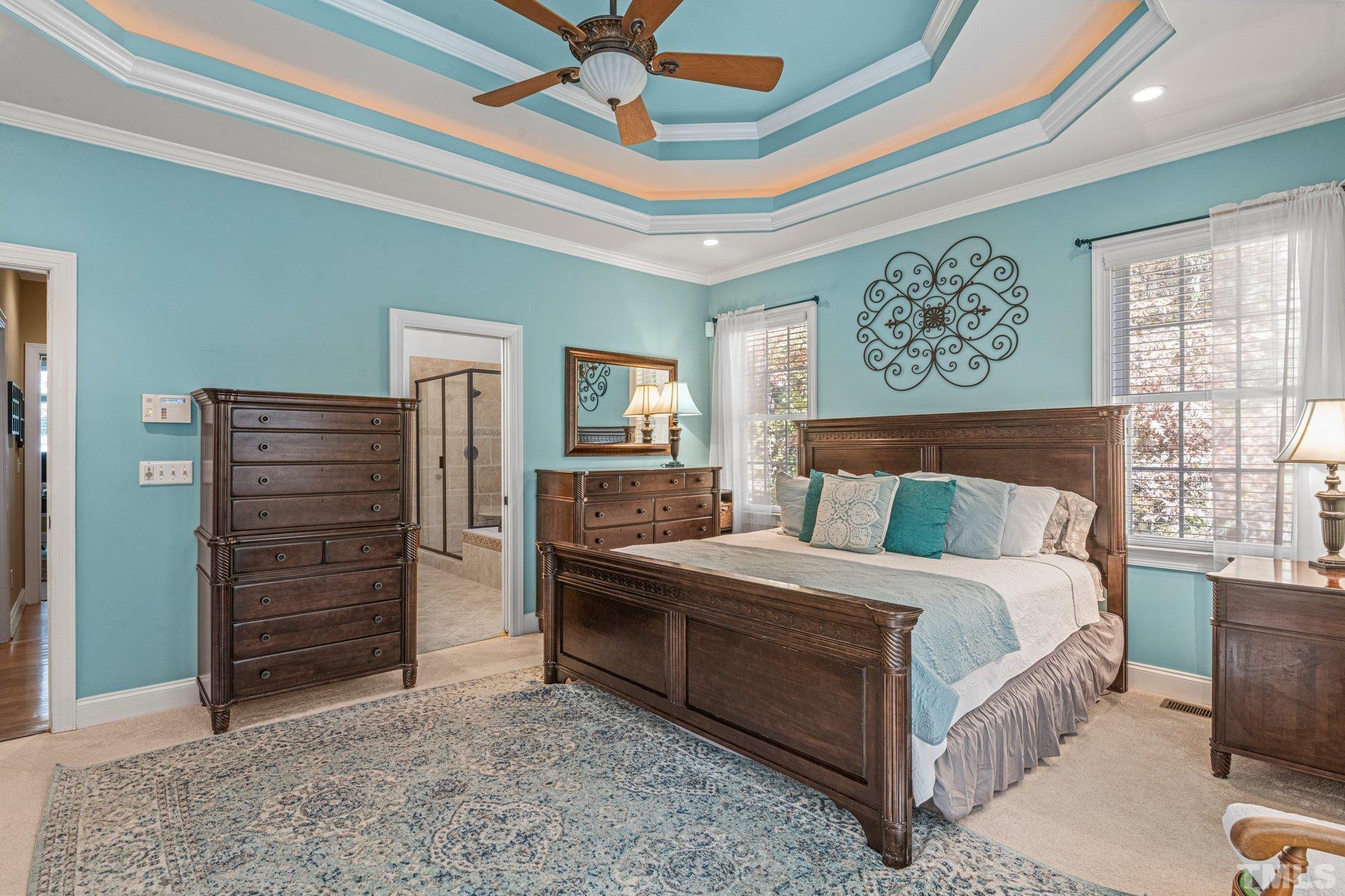 52 Evening Lane Clayton, NC 27527 - Photo 19 of 58 a bedroom with a bed and a mirror