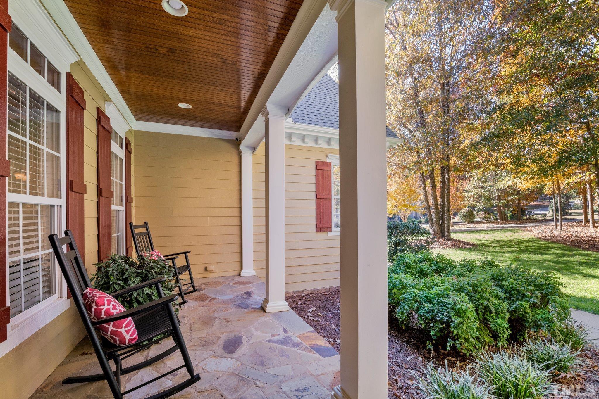 52 Evening Lane Clayton, NC 27527 - Photo 3 of 58 a view of a patio with furniture and potted plants