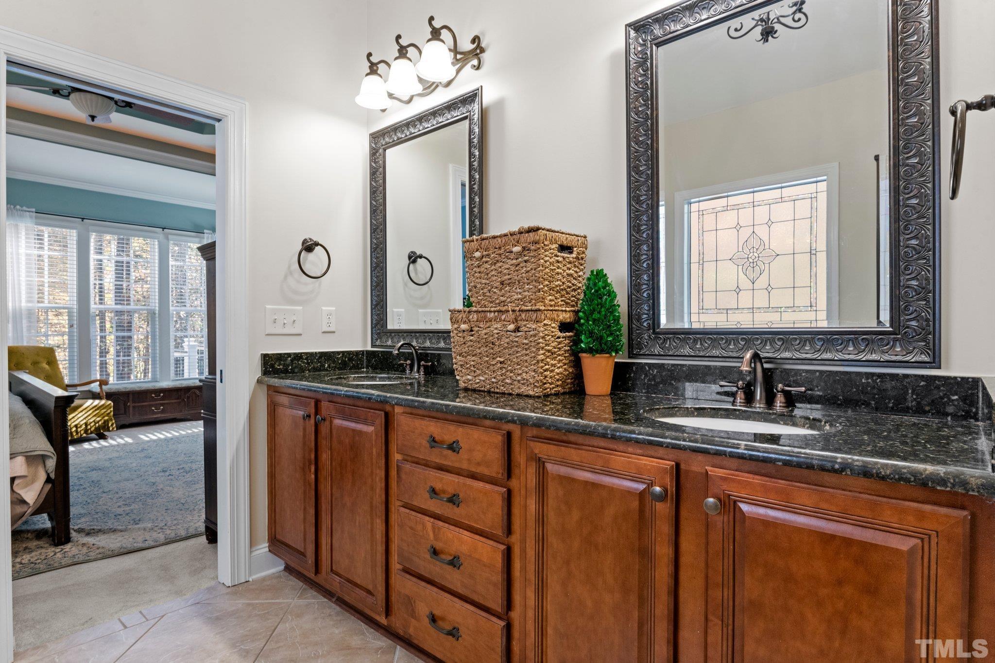 52 Evening Lane Clayton, NC 27527 - Photo 21 of 58 a bathroom with double sink and a mirror