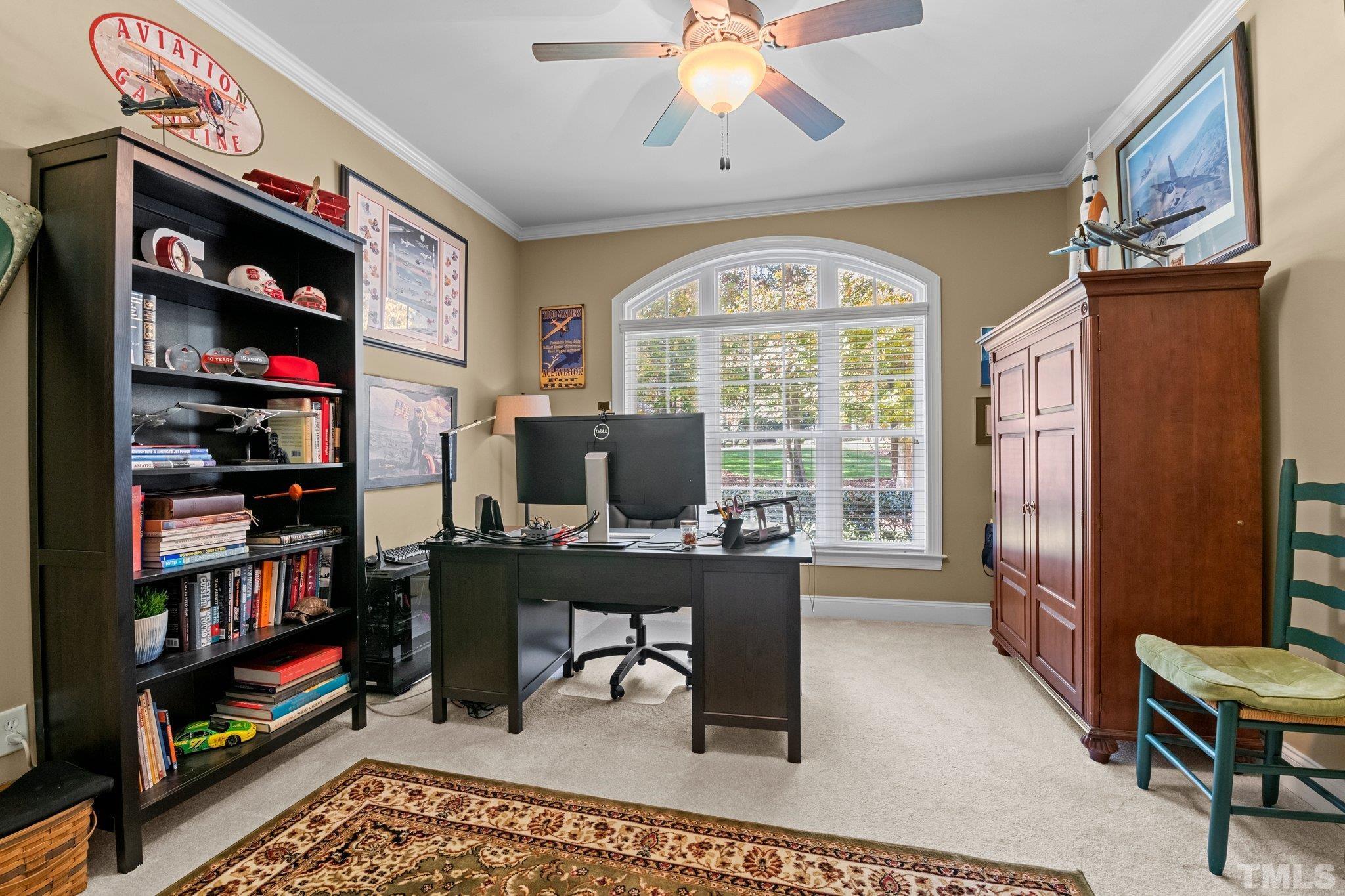 52 Evening Lane Clayton, NC 27527 - Photo 23 of 58 a view of a workspace with a bookshelf