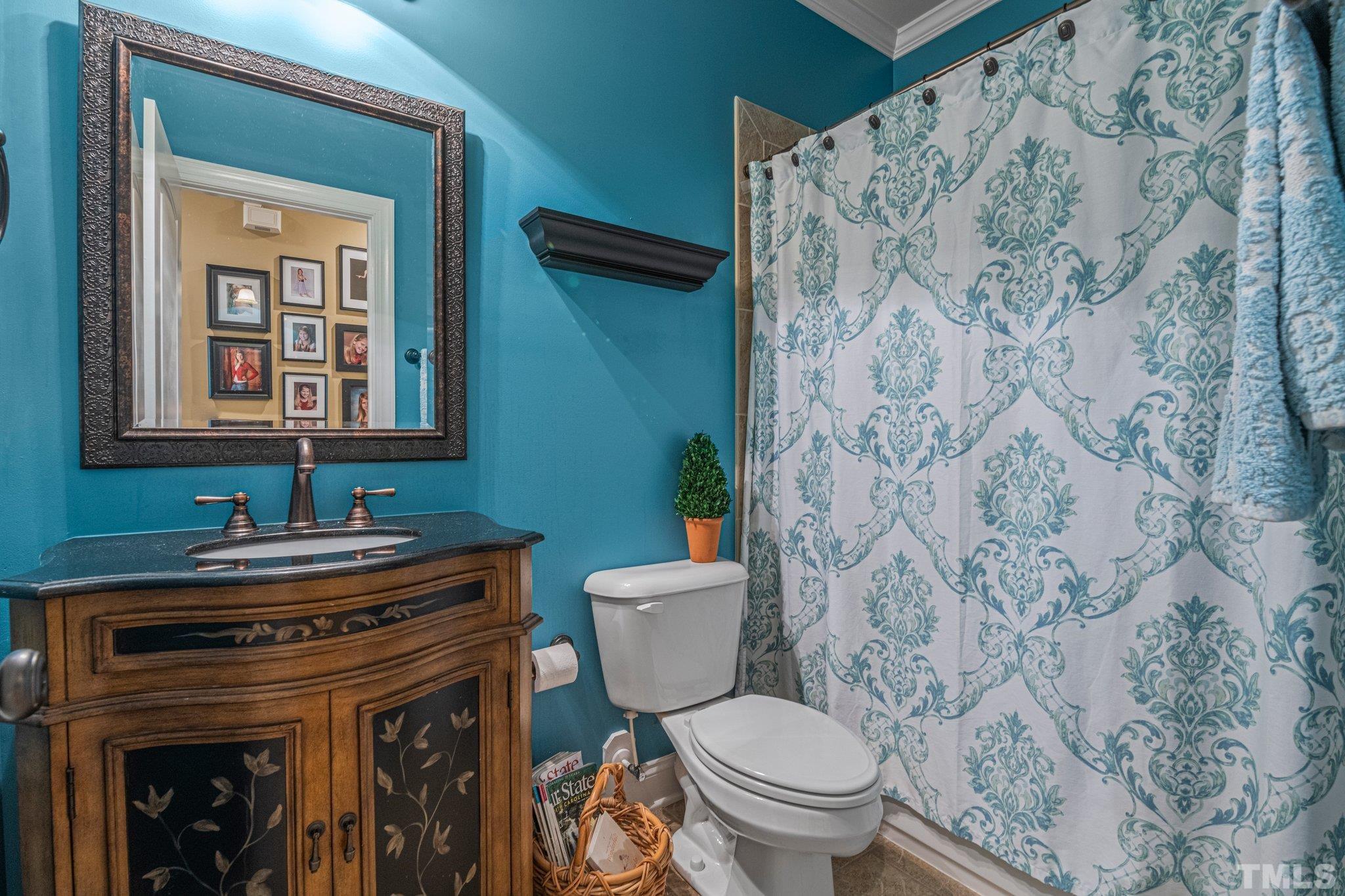 52 Evening Lane Clayton, NC 27527 - Photo 24 of 58 a bathroom with a toilet sink and mirror