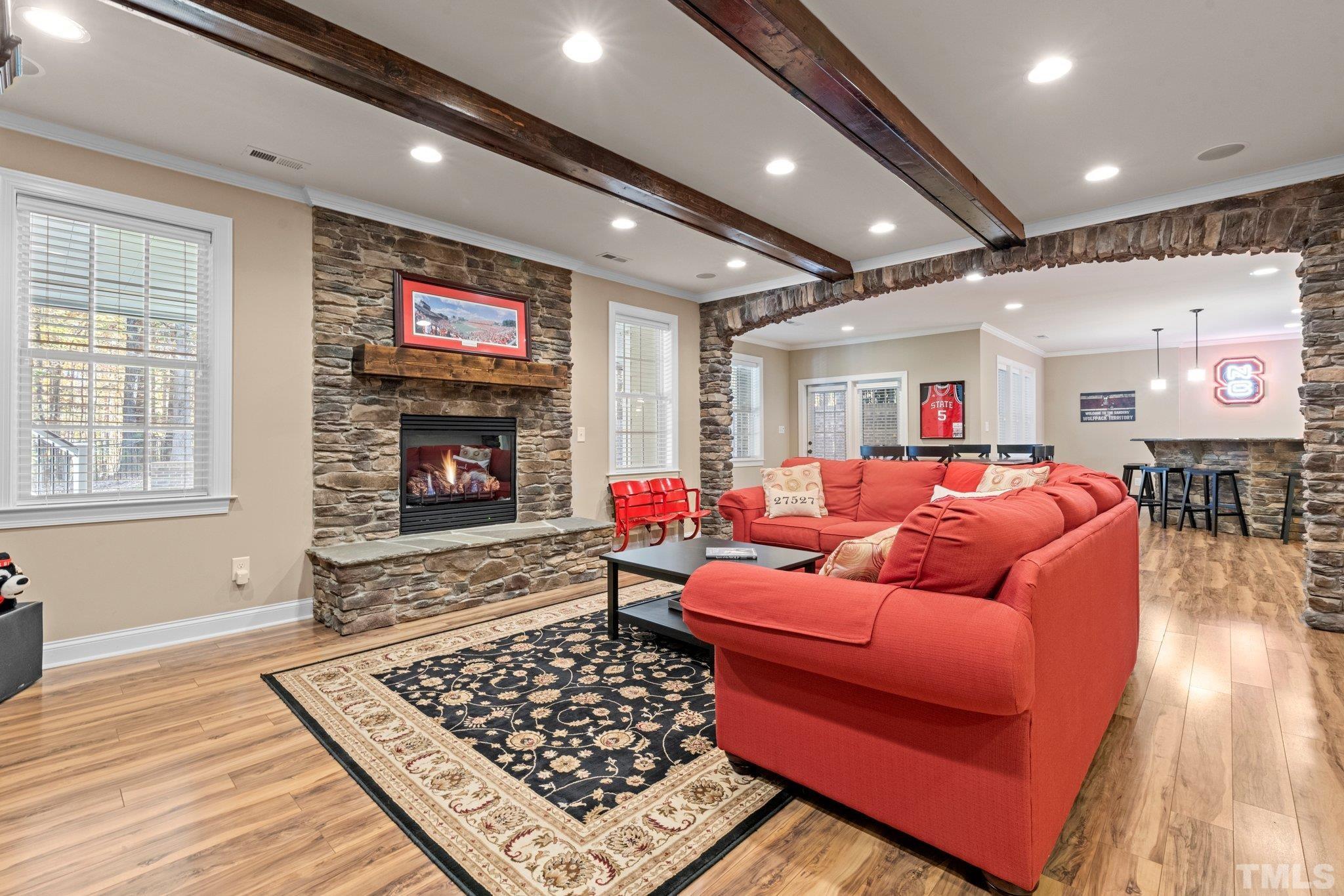 52 Evening Lane Clayton, NC 27527 - Photo 25 of 58 a living room with furniture a flat screen tv and a fireplace