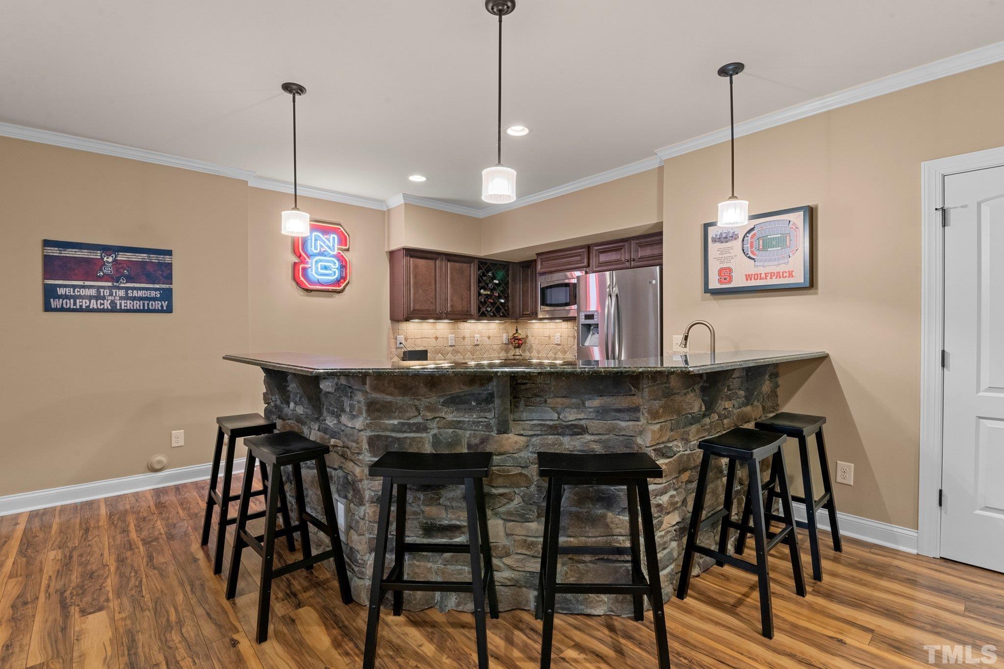 52 Evening Lane Clayton, NC 27527 - Photo 27 of 58 a view of a dining room with furniture wooden floor and chandelier
