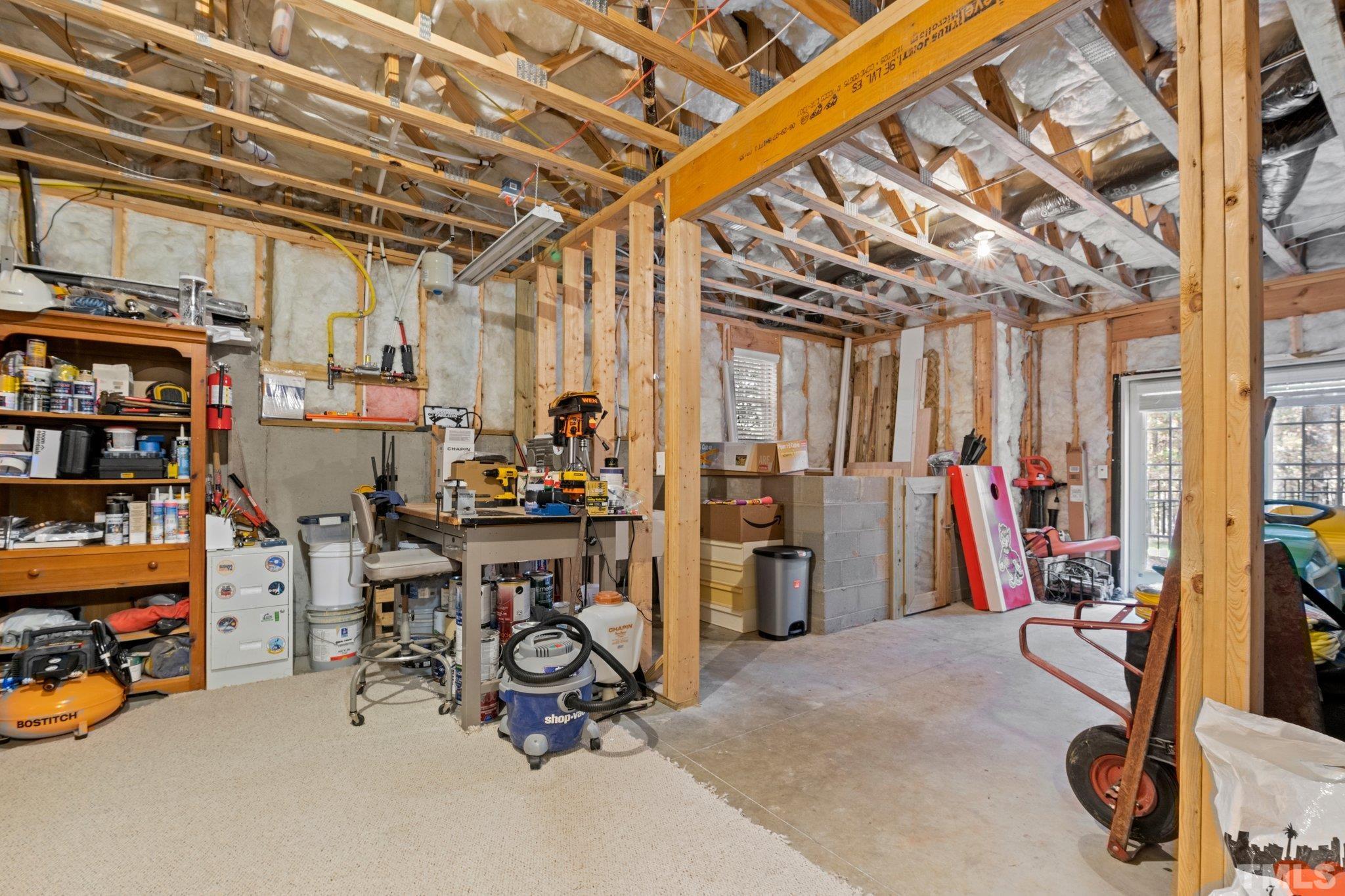 52 Evening Lane Clayton, NC 27527 - Photo 32 of 58 a view of a room with gym equipment