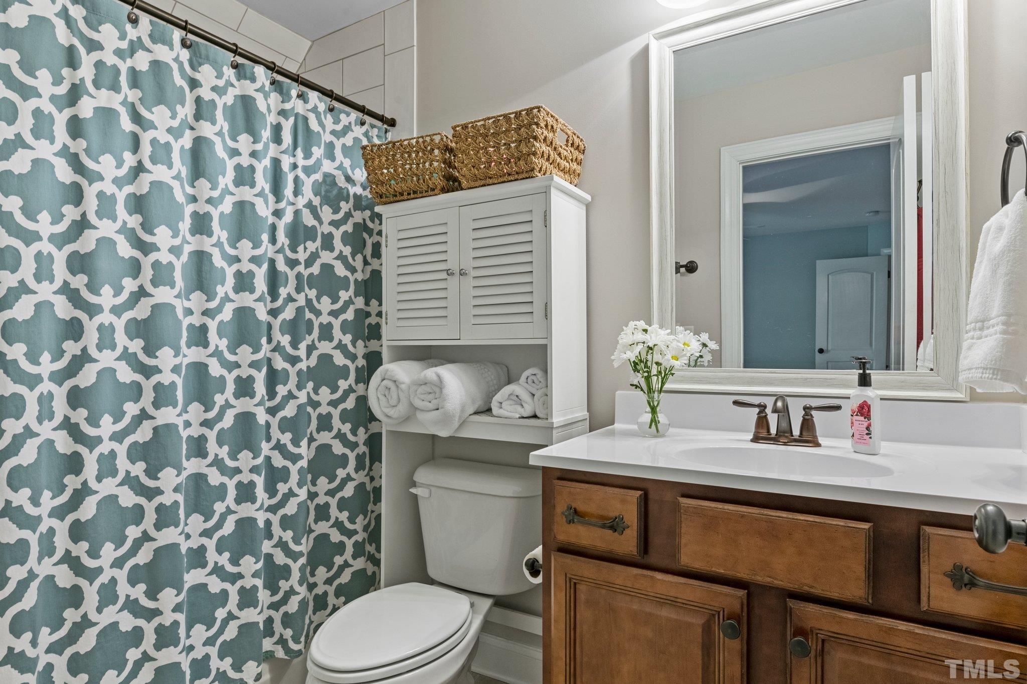 52 Evening Lane Clayton, NC 27527 - Photo 35 of 58 a bathroom with a granite countertop sink and a toilet