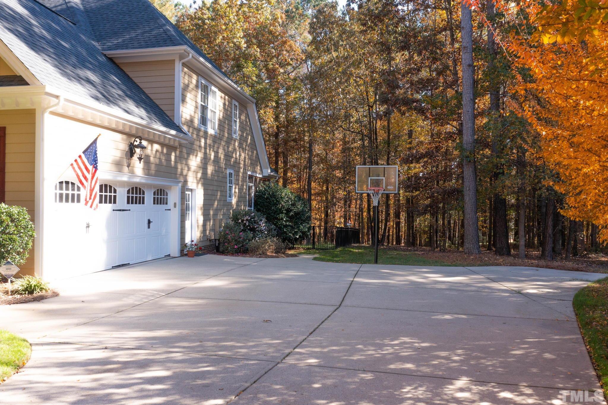 52 Evening Lane Clayton, NC 27527 - Photo 40 of 58 a view of a building with trees in the background