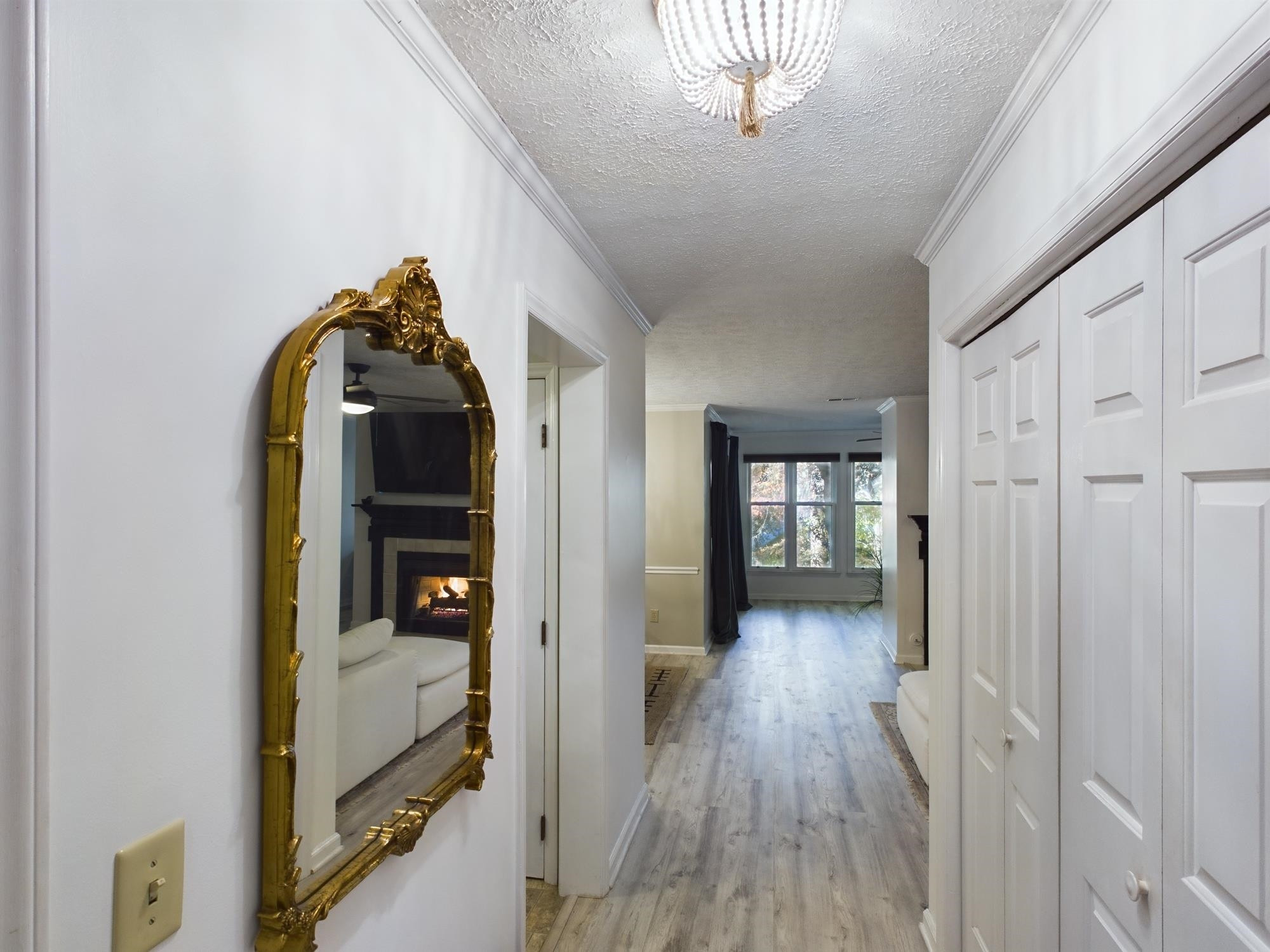 705 Broad Leaf Circle, Unit 705 Raleigh, NC 27613 - Photo 3 of 31 a view of a hallway with wooden floor and staircase