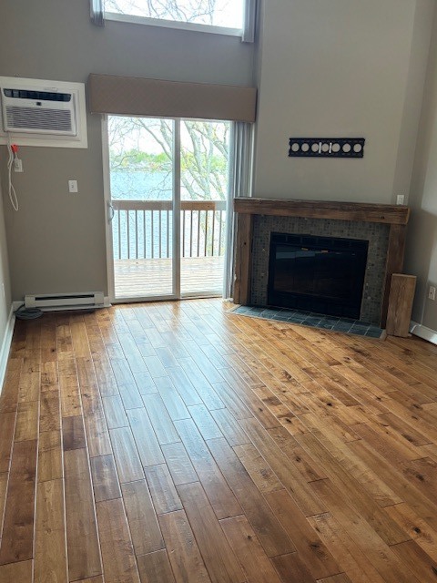 6930 238th Avenue, Unit 6 Paddock Lake, WI 53168 - Photo 18 of 36 a view of empty room with wooden floor and fireplace