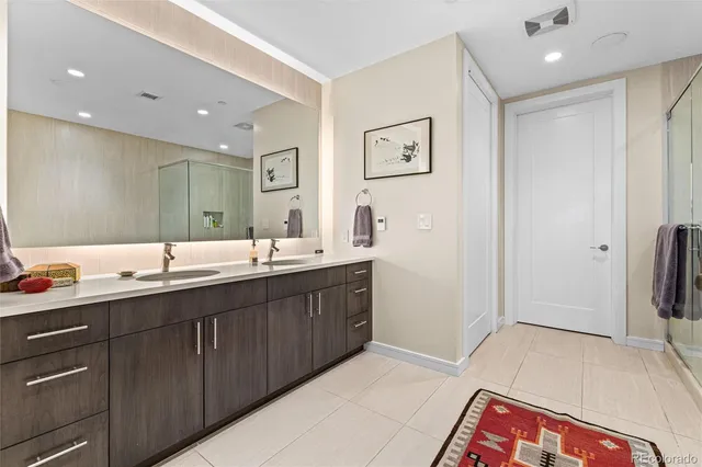 a bathroom with a sink a toilet a tub and a shower