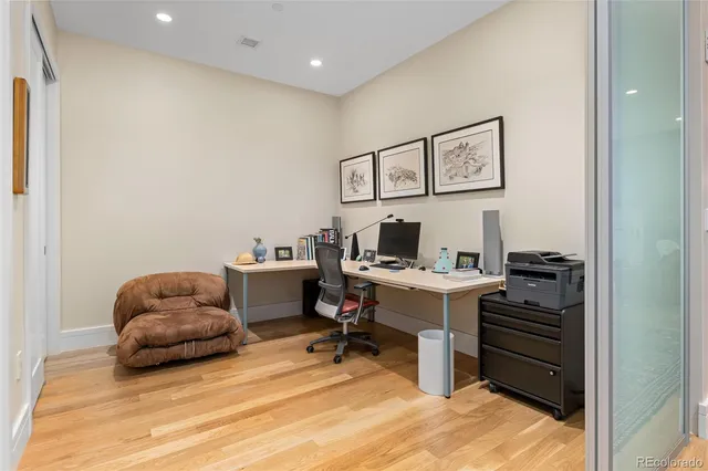 a workspace with furniture and wooden floor