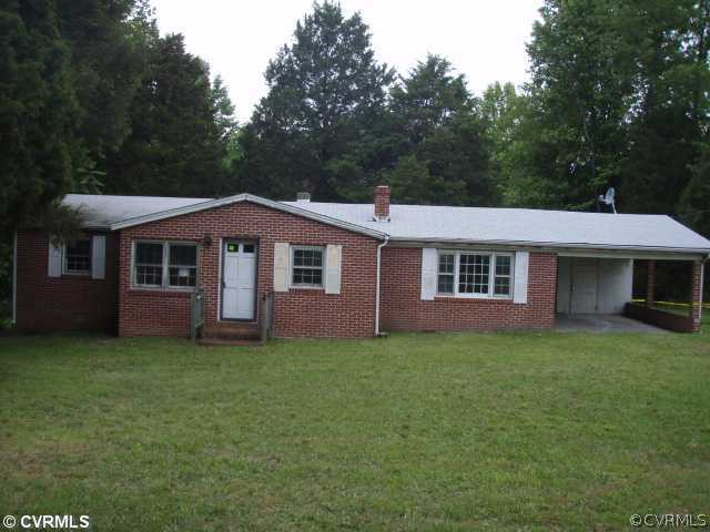1775 Courthouse Road Louisa, VA 23093 - Photo 1 of 10 a front view of a house with a garden