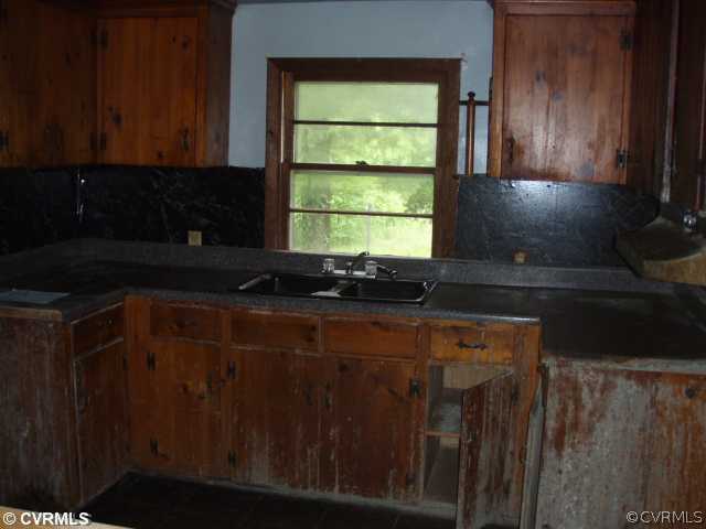 1775 Courthouse Road Louisa, VA 23093 - Photo 5 of 10 a kitchen with a sink a window and cabinets