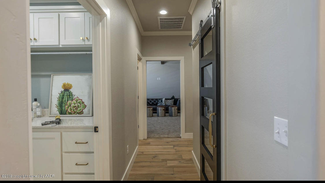 6720 Arnot Road Amarillo, TX 79119 - Photo 18 of 68 Utility / Pantry / Den Hallway