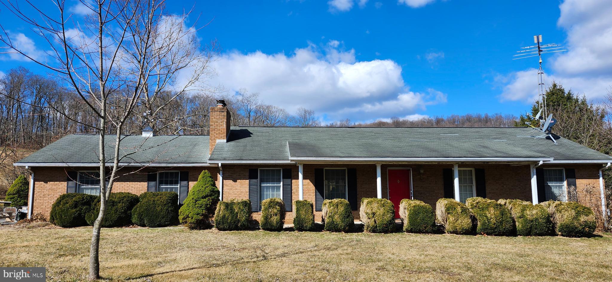 12440 Indian Springs Road Clear Spring, MD 21722 - Photo 2 of 35 a front view of a house with garden
