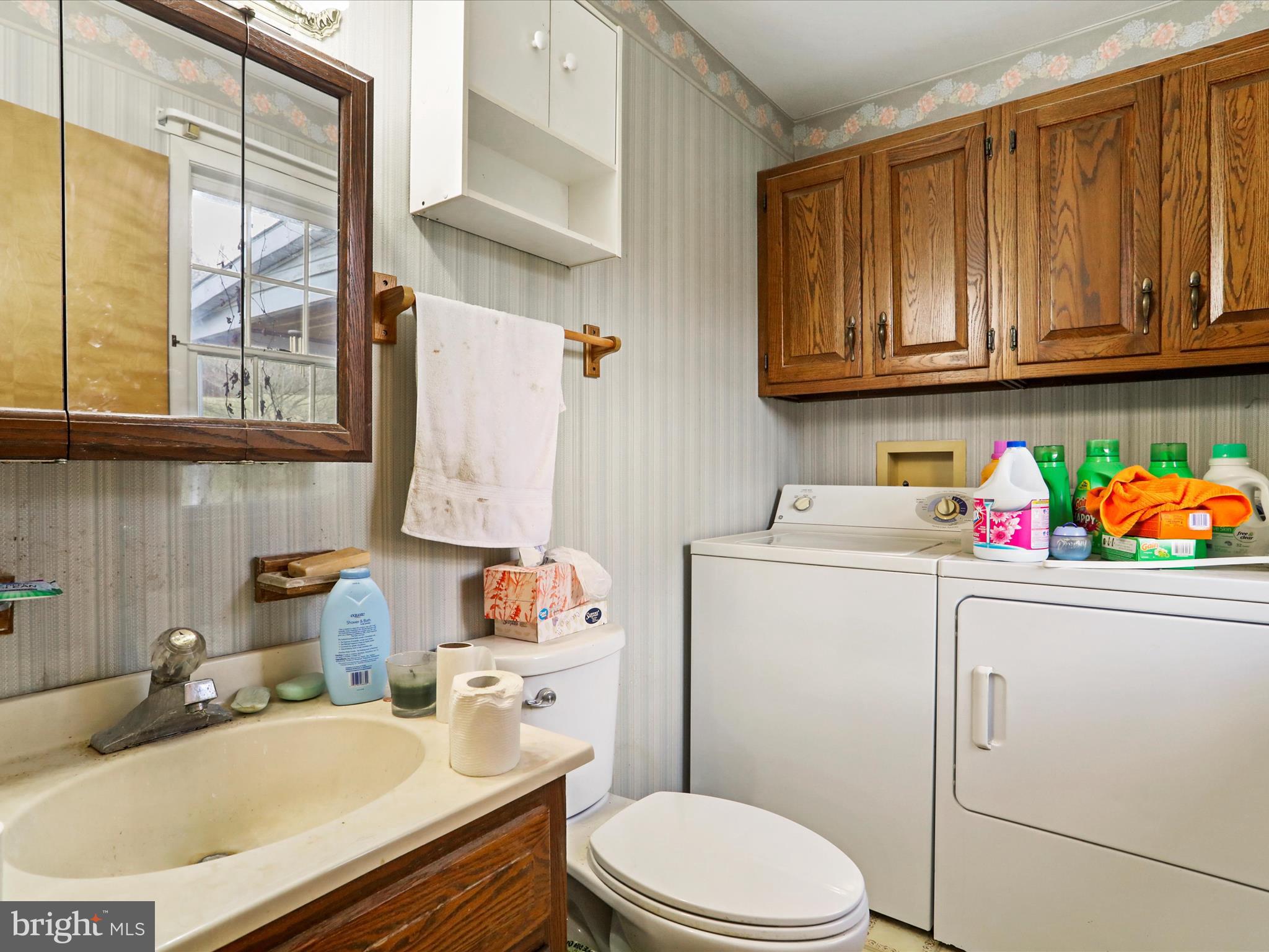 12440 Indian Springs Road Clear Spring, MD 21722 - Photo 27 of 35 a bathroom with a sink toilet vanity and window