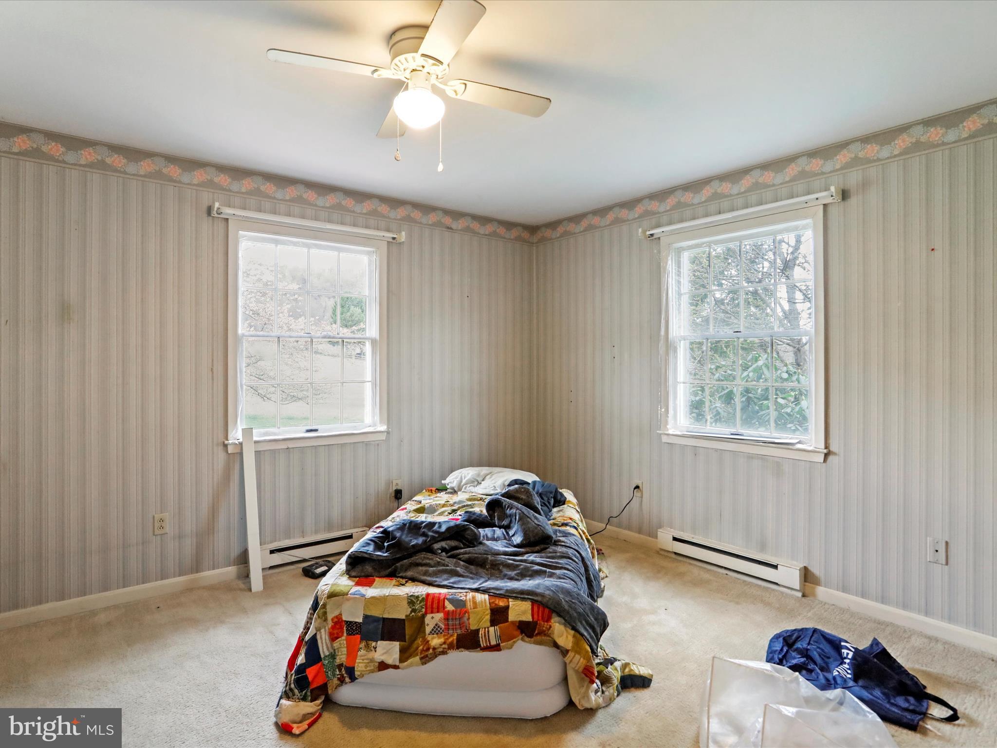 12440 Indian Springs Road Clear Spring, MD 21722 - Photo 28 of 35 a bedroom with a bed and a chandelier