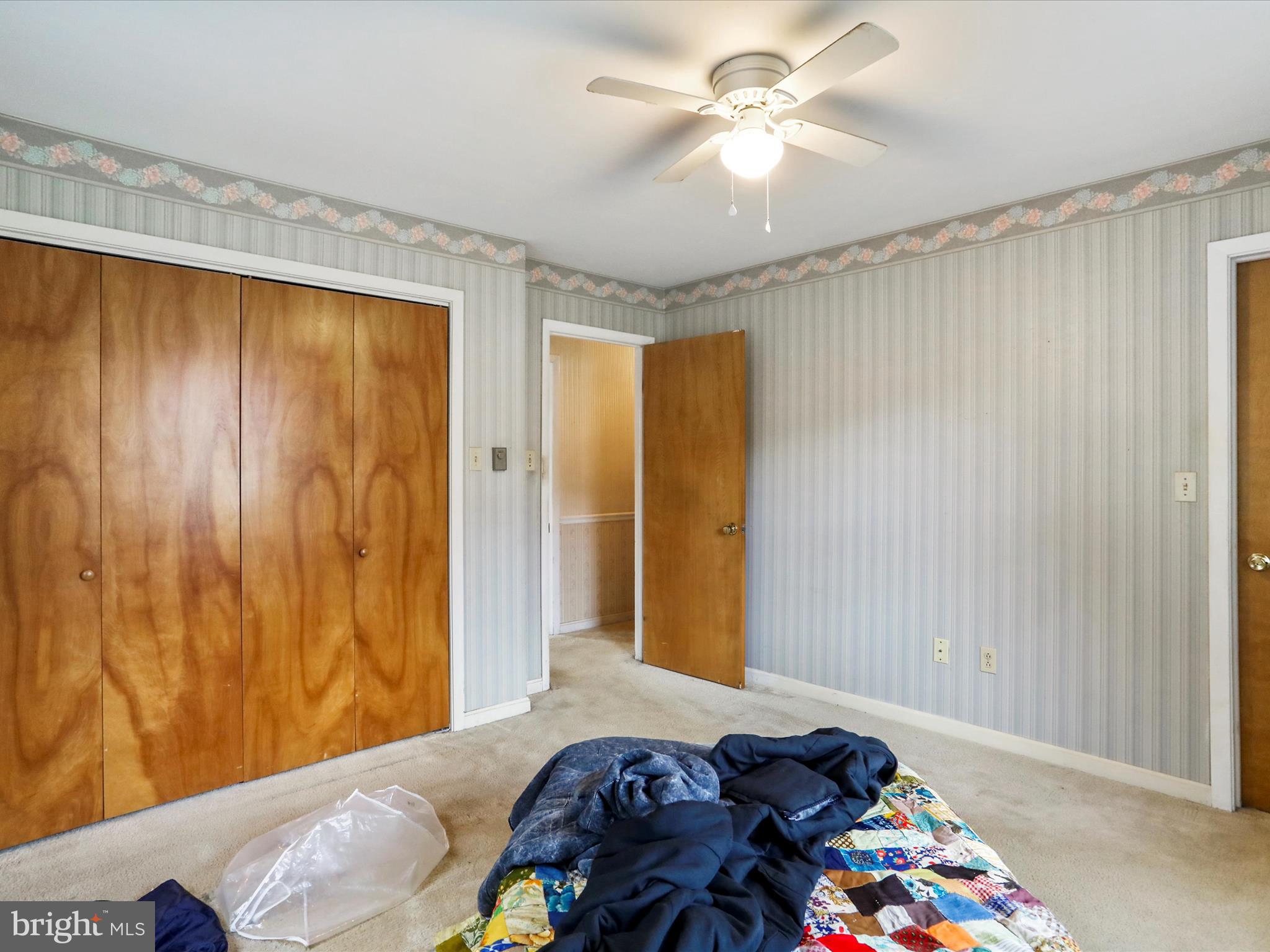 12440 Indian Springs Road Clear Spring, MD 21722 - Photo 29 of 35 a bedroom with a bed and a chandelier