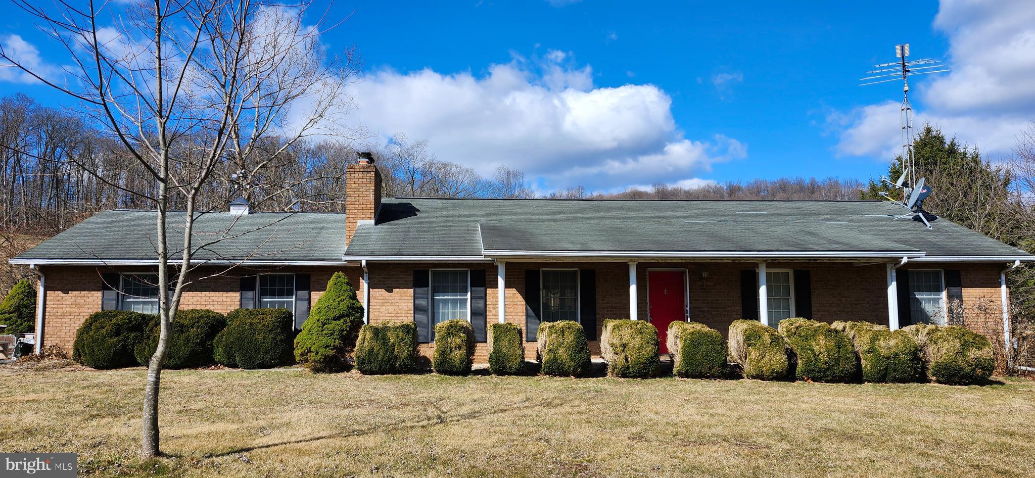 12440 Indian Springs Road Clear Spring, MD 21722 - Photo 3 of 35 a front view of a house with a yard