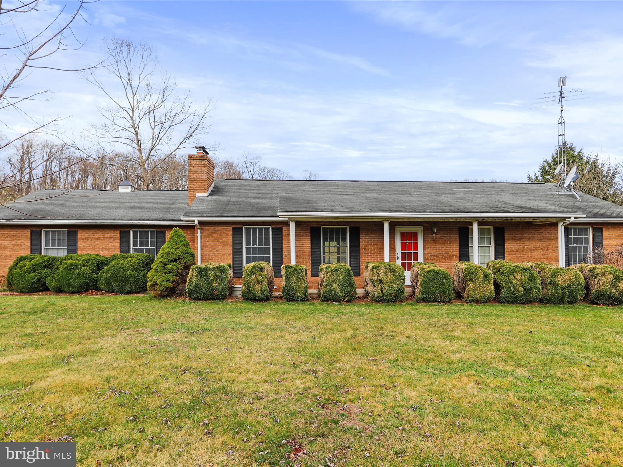 12440 Indian Springs Road Clear Spring, MD 21722 - Photo 4 of 35 a view of a brick house with a yard