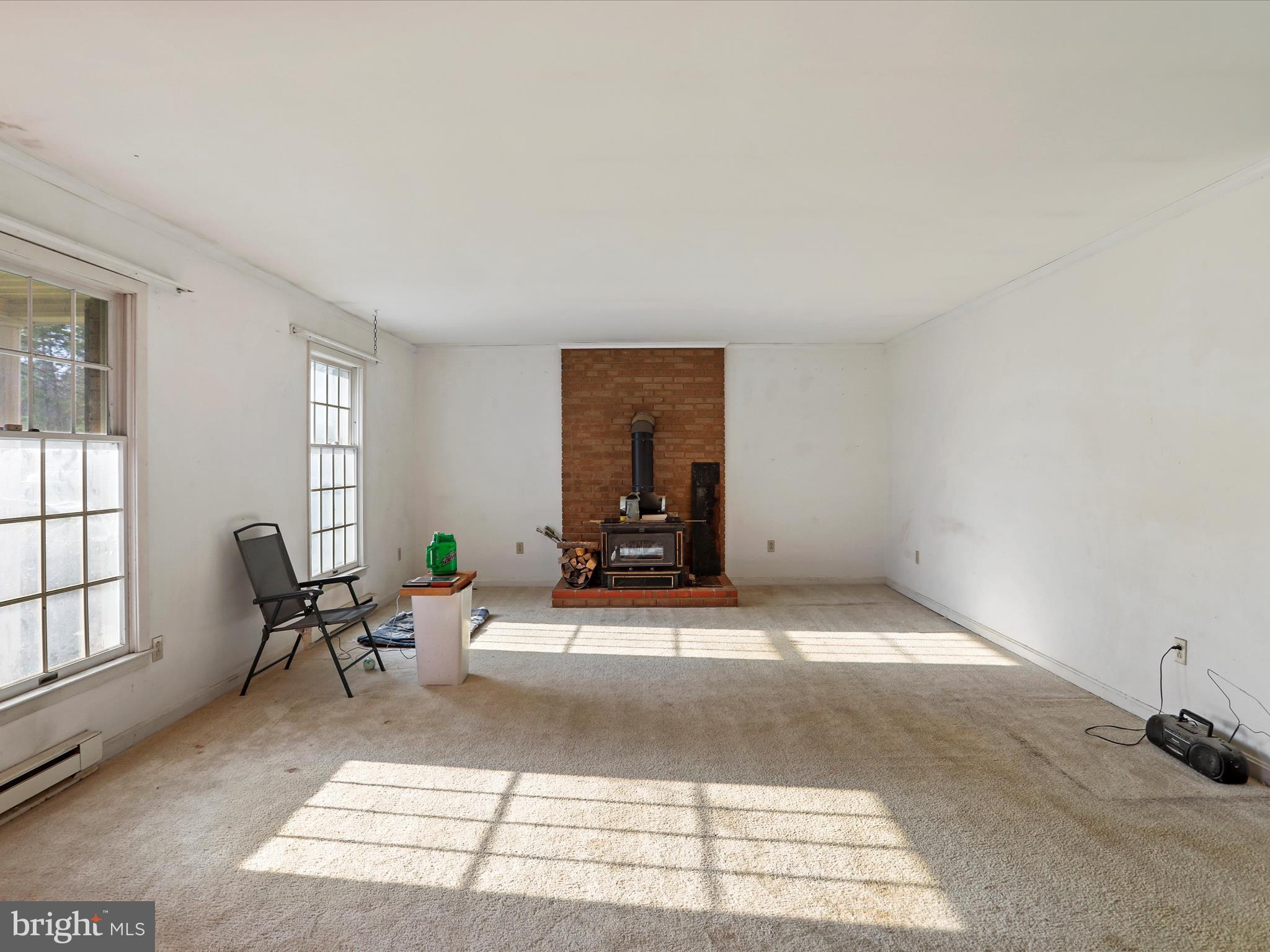 12440 Indian Springs Road Clear Spring, MD 21722 - Photo 9 of 35 a living room with furniture a window and a table