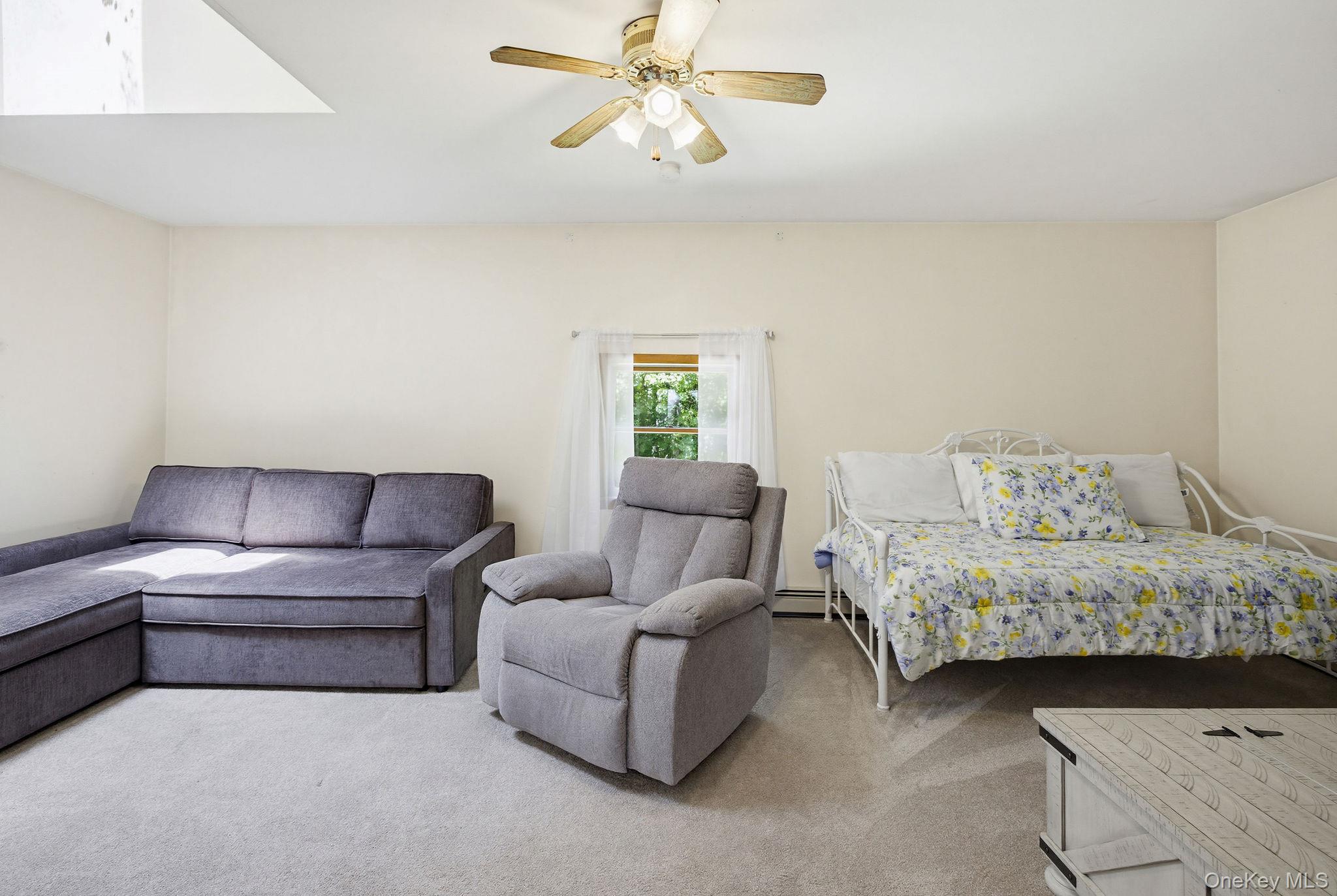 12 Bradhurst Road Carmel, NY 10512 - Photo 16 of 28 a living room with furniture and a couch