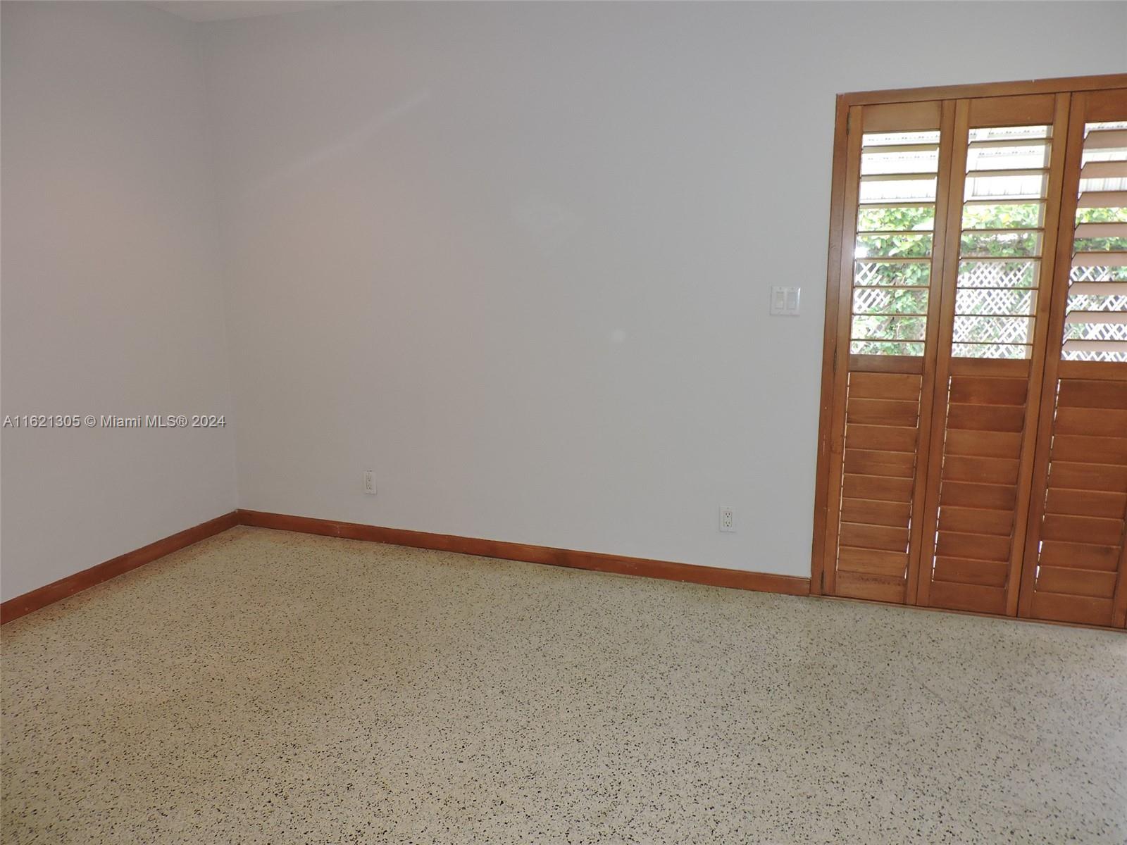 1630 Tyler Street Hollywood, FL 33020 - Photo 13 of 26 a view of an empty room with a window