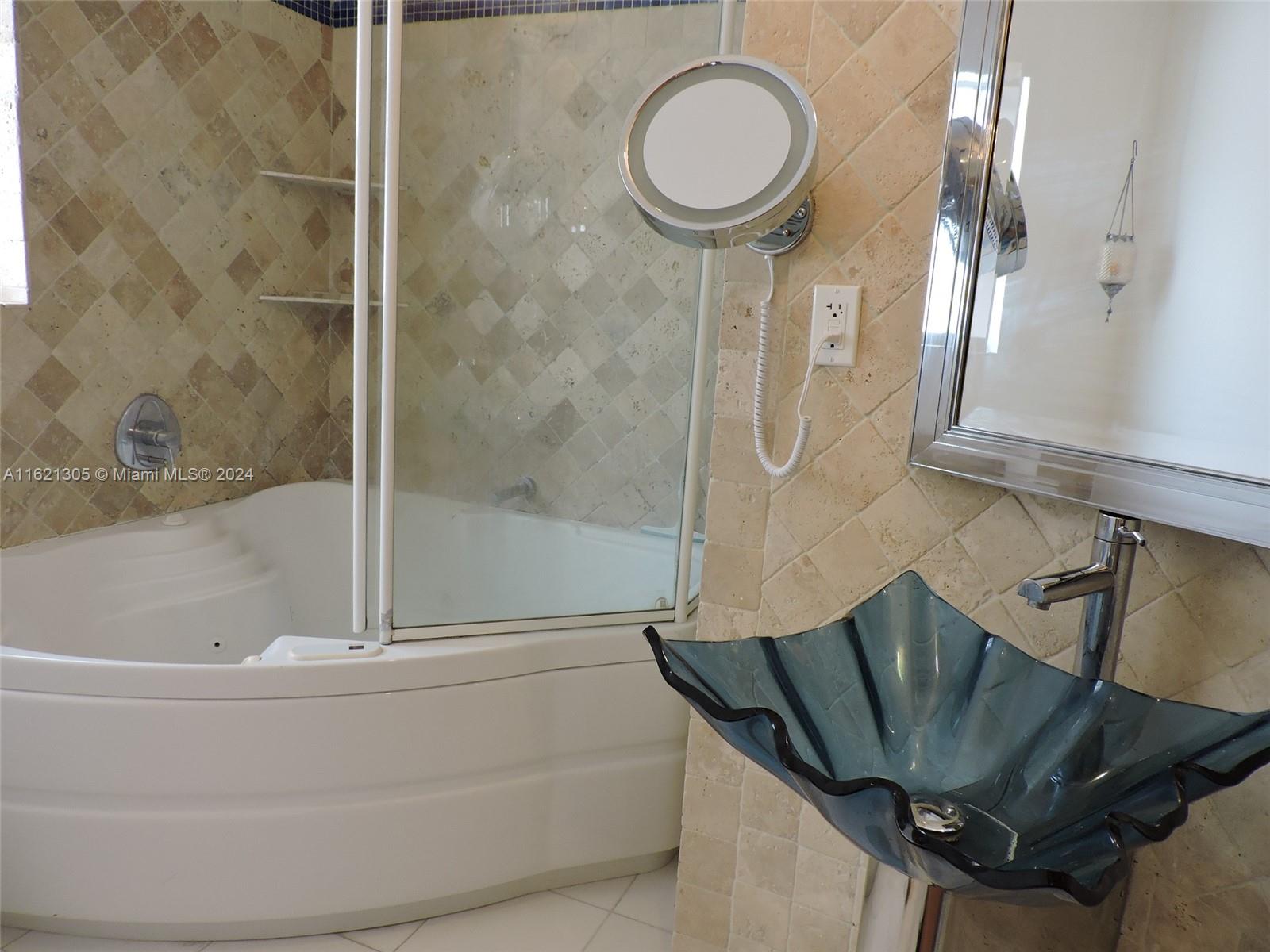 1630 Tyler Street Hollywood, FL 33020 - Photo 15 of 26 a bathroom with a bathtub