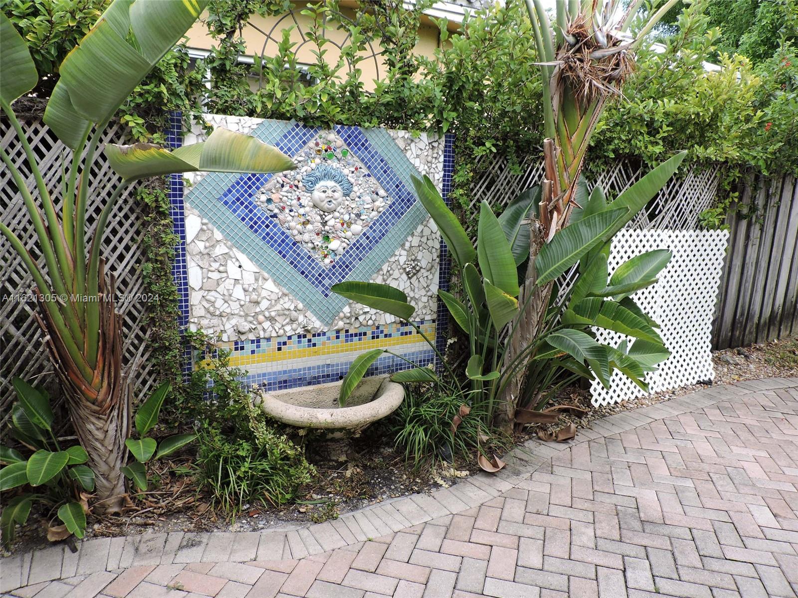 1630 Tyler Street Hollywood, FL 33020 - Photo 17 of 26 a view of a backyard with plants and plants